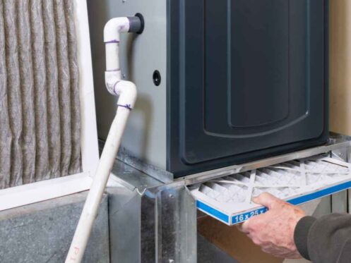 Replacing an air filter in a furnace in a home